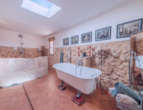 a room with a sink and a bath tub